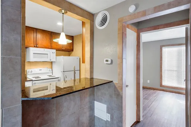 a view of a kitchen cabinets and a counter place