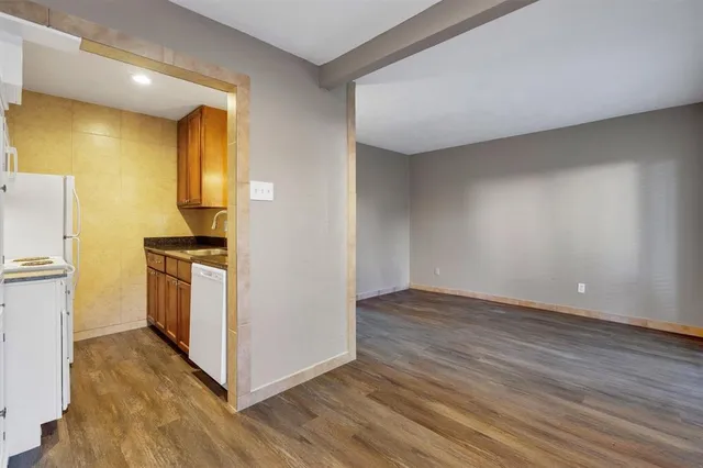 a view of a kitchen with wooden floor