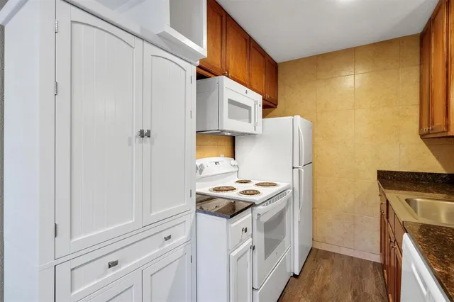 a kitchen with stainless steel appliances a stove and a refrigerator