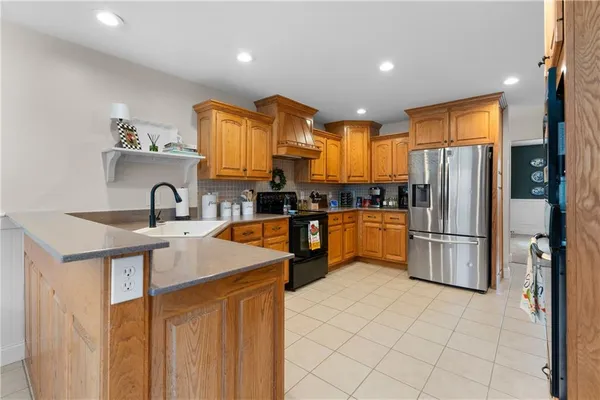 a kitchen with stainless steel appliances a refrigerator and a sink