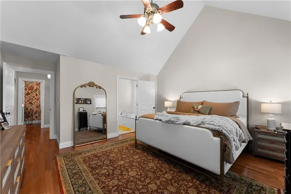 a bed room with a bed and a chandelier