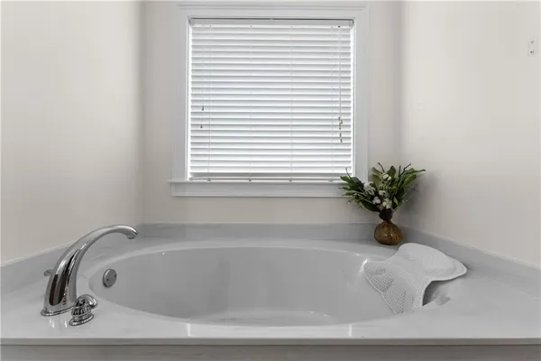 a white bath tub sitting in a bathroom