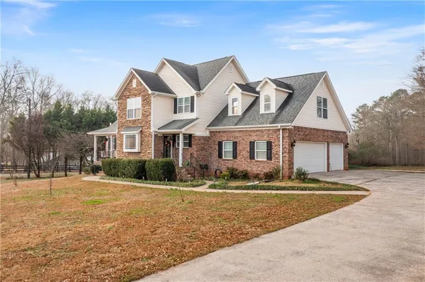 a front view of a house with a yard