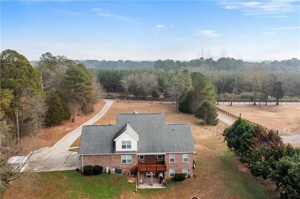 an aerial view of a house with mountain view