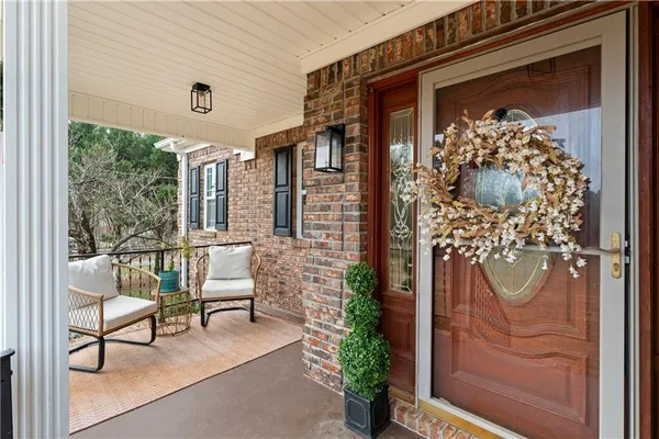 a front view of a house with outdoor seating