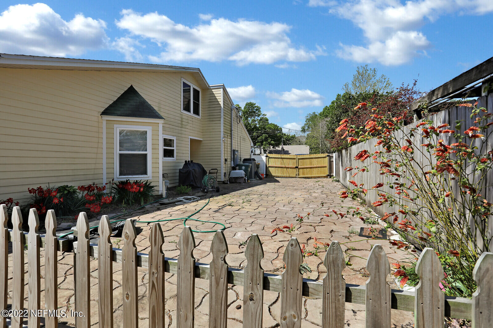3413 Thalia Road Jacksonville, FL 32250 - Photo 4 of 7 a view of a house with wooden fence