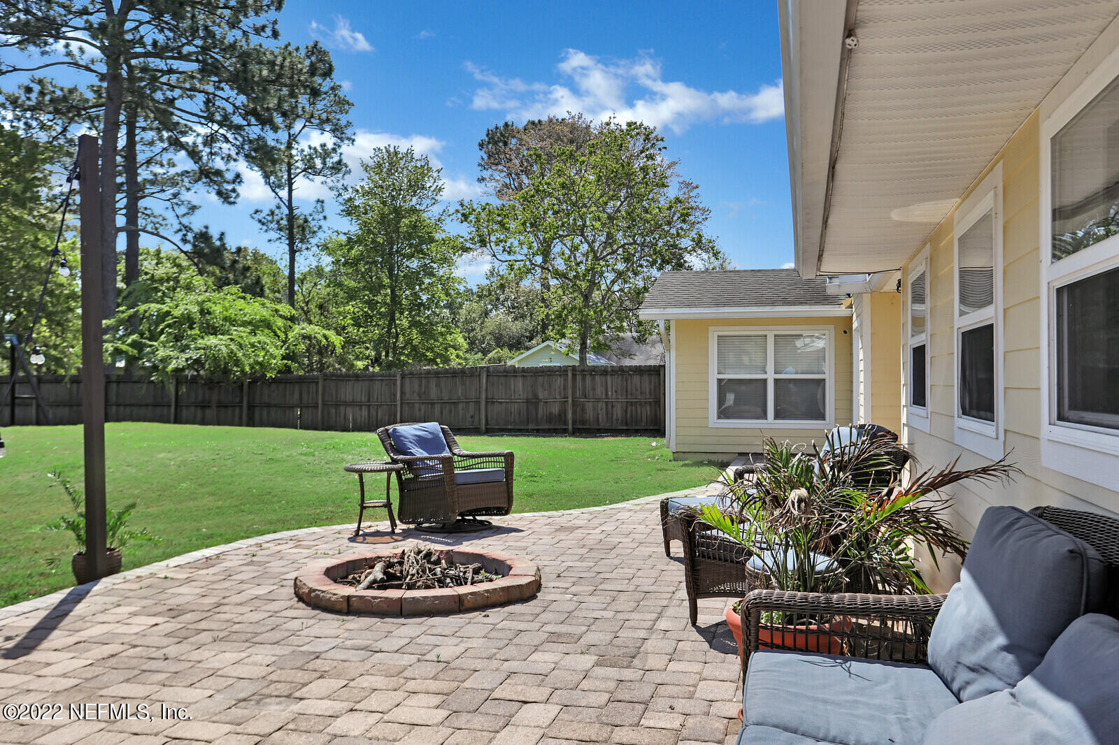 3413 Thalia Road Jacksonville, FL 32250 - Photo 5 of 7 a view of a backyard with plants and a garden