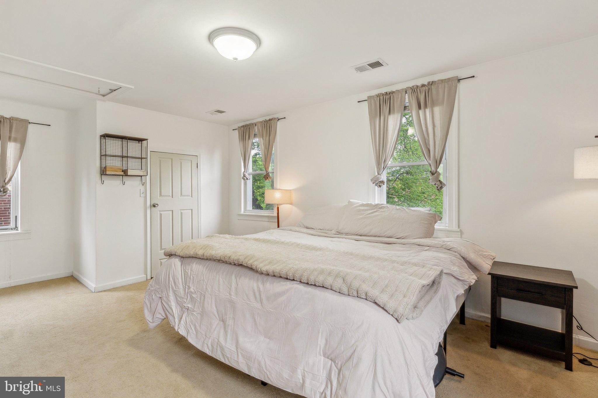 5207 Eugene Avenue Baltimore, MD 21206 - Photo 15 of 36 a bedroom with a bed and a window