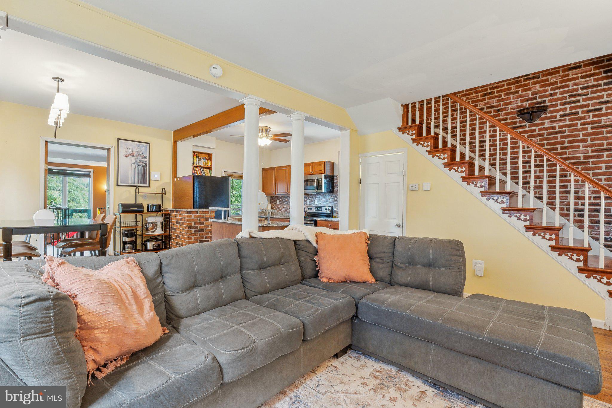 5207 Eugene Avenue Baltimore, MD 21206 - Photo 2 of 36 a living room with furniture and a large window