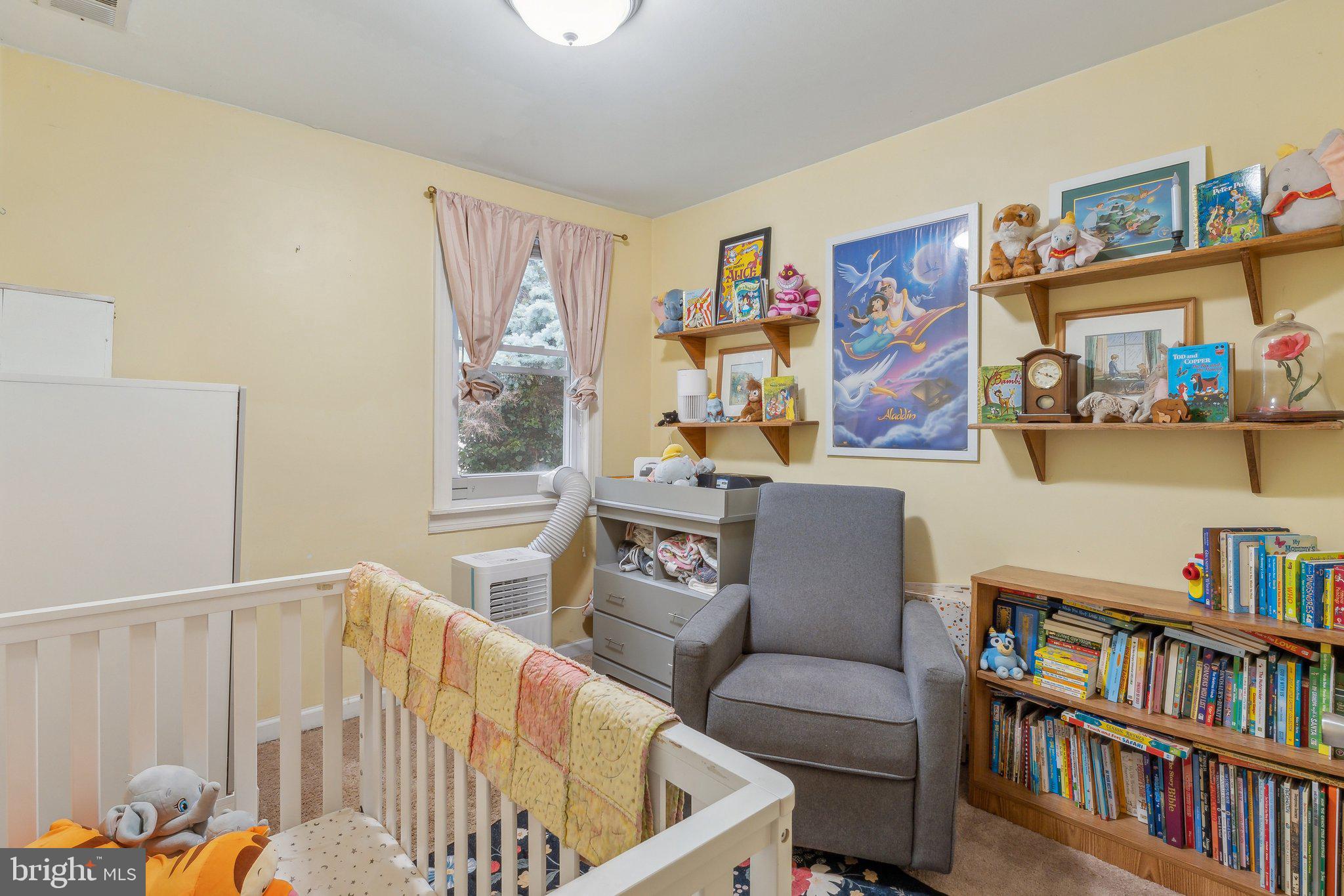 5207 Eugene Avenue Baltimore, MD 21206 - Photo 21 of 36 a living room with furniture and a book shelf