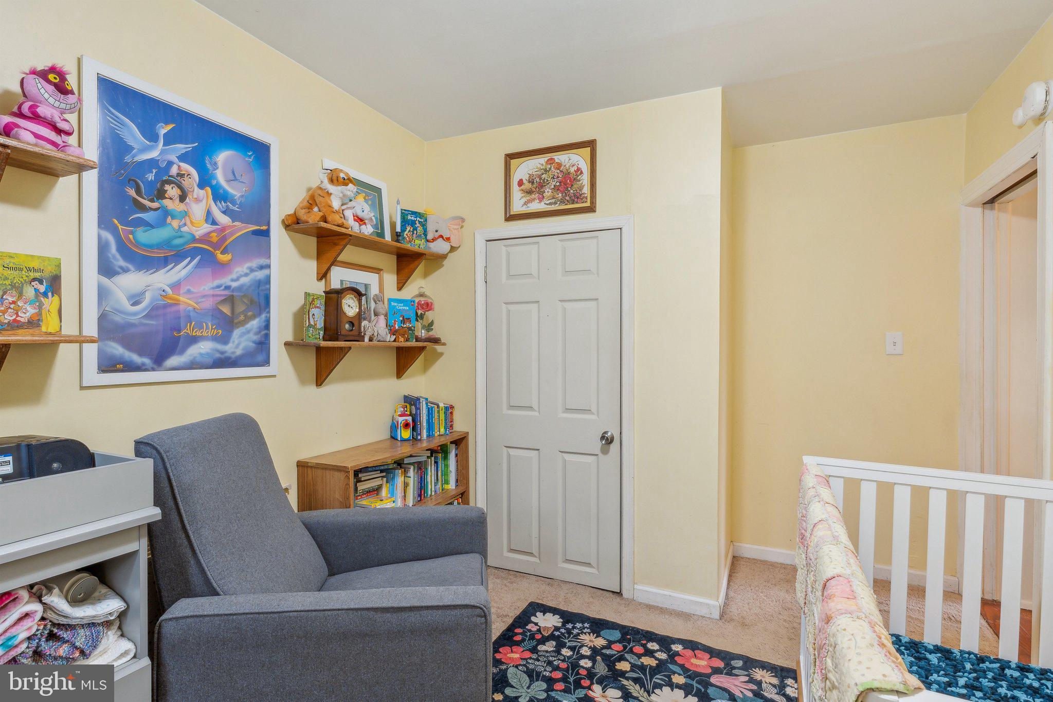 5207 Eugene Avenue Baltimore, MD 21206 - Photo 22 of 36 a living room with furniture and a couch