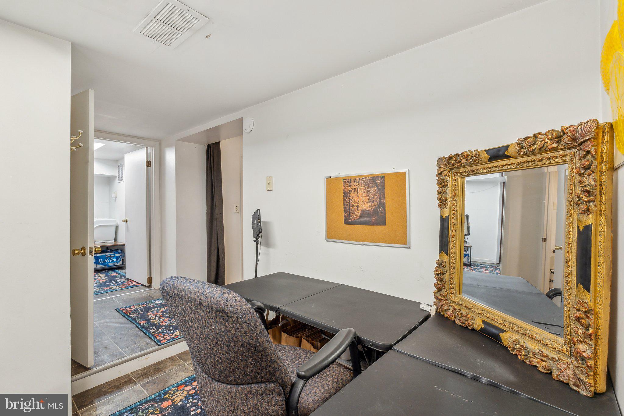 5207 Eugene Avenue Baltimore, MD 21206 - Photo 26 of 36 a living room with furniture and a window