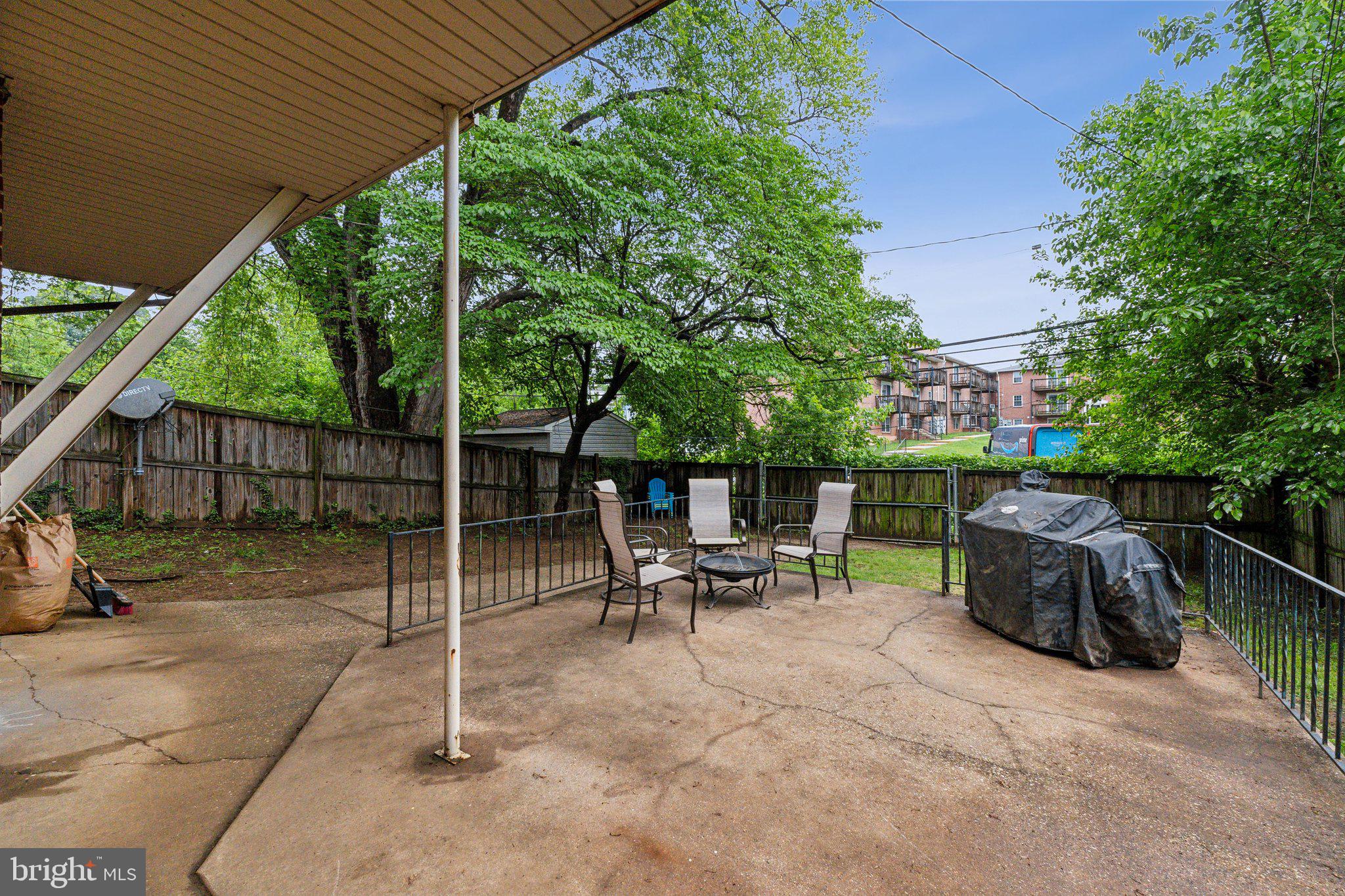 5207 Eugene Avenue Baltimore, MD 21206 - Photo 30 of 36 a view of backyard with outdoor seating and trees