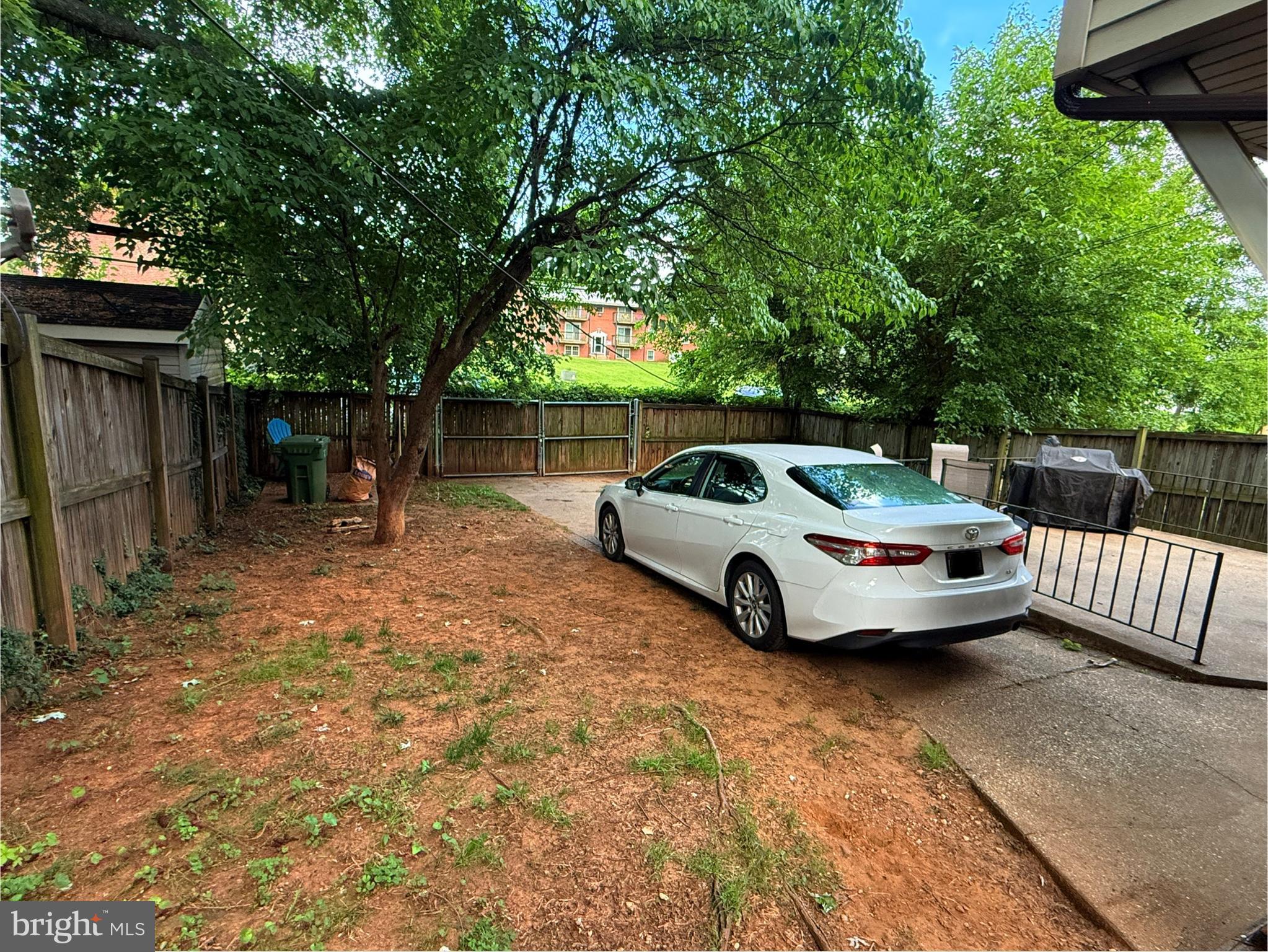 5207 Eugene Avenue Baltimore, MD 21206 - Photo 35 of 36 a view of a backyard with a car parked