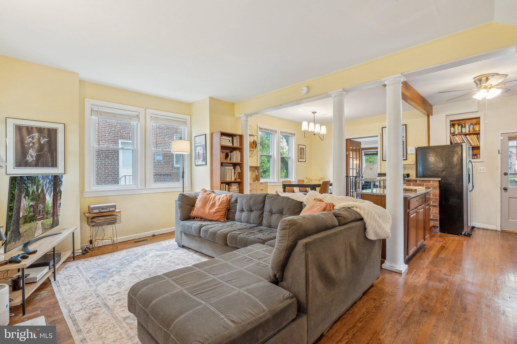 5207 Eugene Avenue Baltimore, MD 21206 - Photo 4 of 36 a living room with furniture and a large window