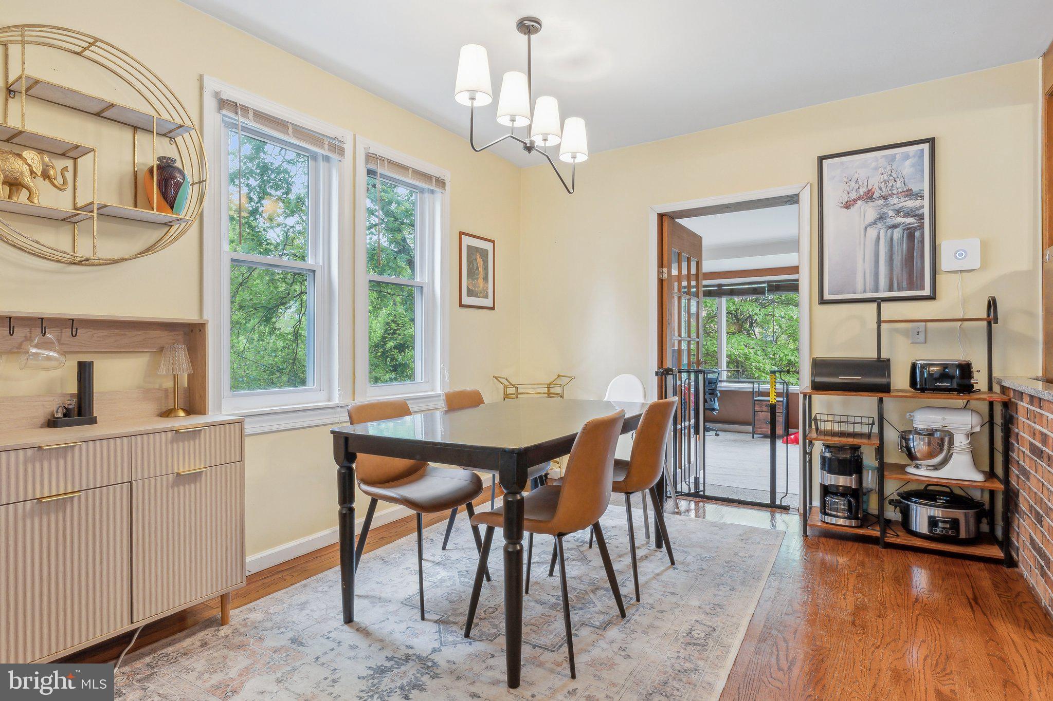 5207 Eugene Avenue Baltimore, MD 21206 - Photo 5 of 36 a view of a dining room with furniture window and wooden floor
