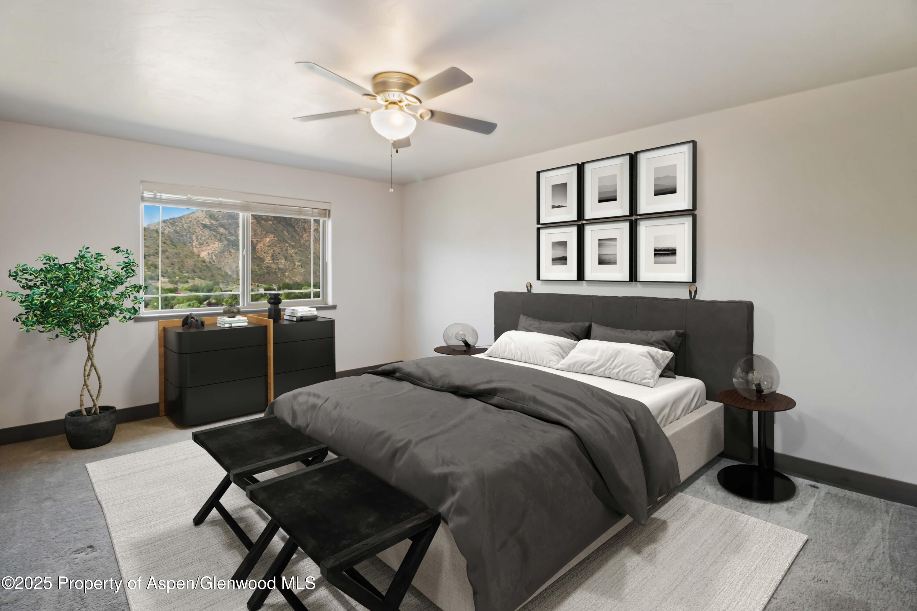 123 Redstone Drive New Castle, CO 81647 - Photo 20 of 34 a bedroom with a bed and a table