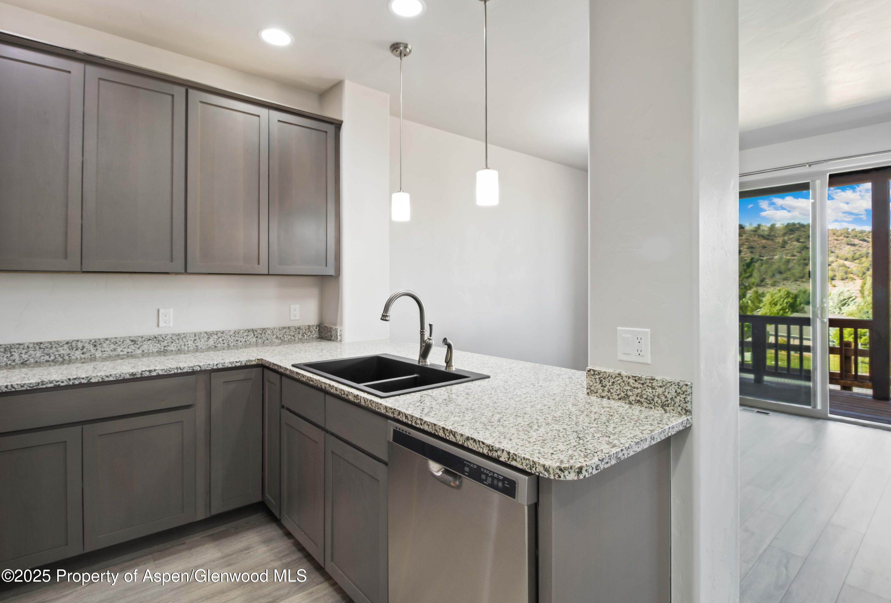 123 Redstone Drive New Castle, CO 81647 - Photo 22 of 34 a kitchen with a sink and cabinets