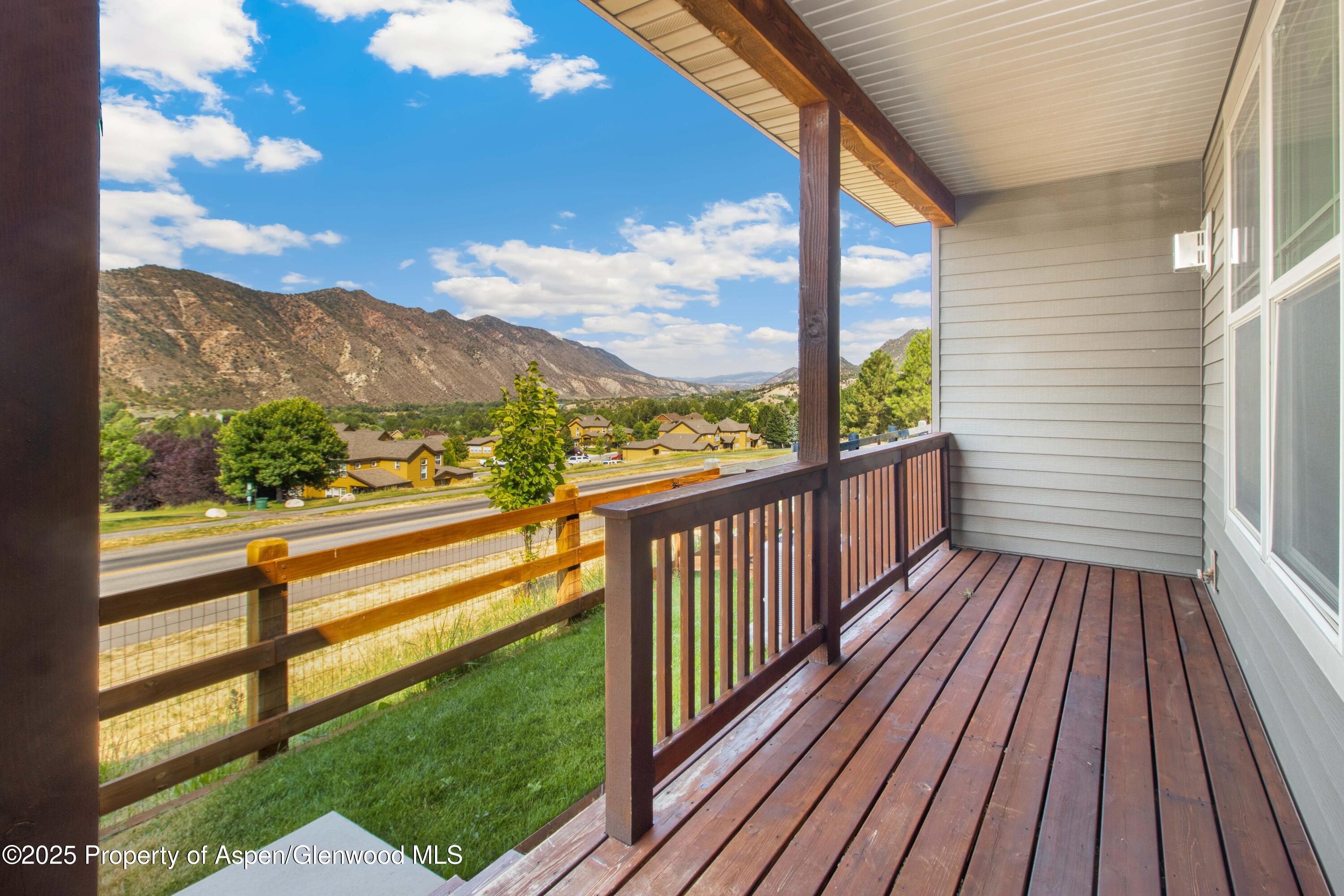 123 Redstone Drive New Castle, CO 81647 - Photo 33 of 34 a view of a porch with wooden floor and outdoor space