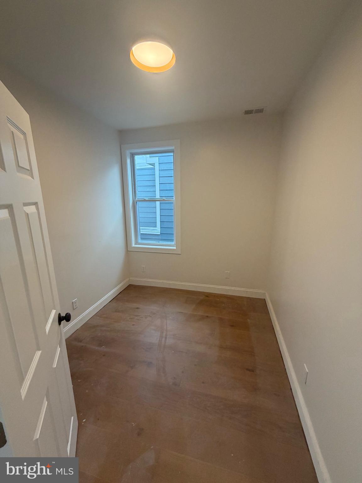 1224 Maryland Avenue Northeast, Unit 3 Washington, DC 20002 - Photo 5 of 12 an empty room with windows