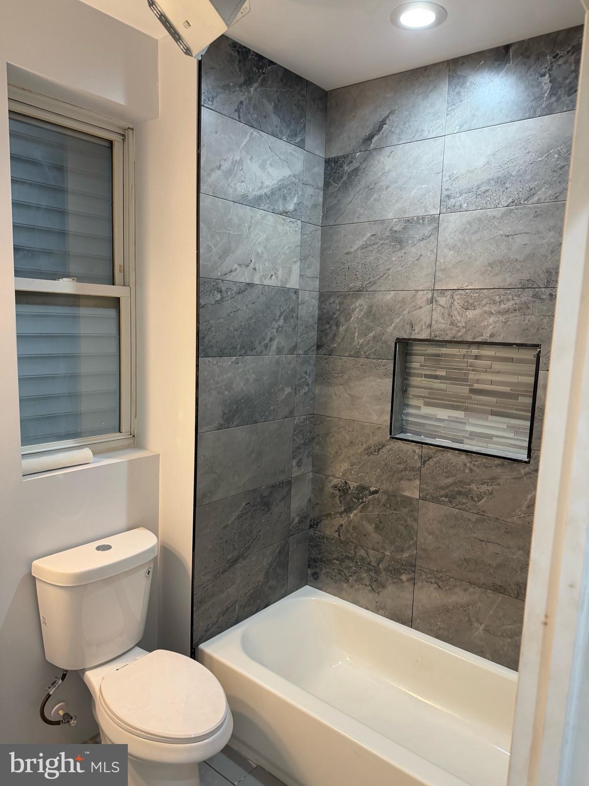 1224 Maryland Avenue Northeast, Unit 3 Washington, DC 20002 - Photo 9 of 12 a bathroom with a toilet and a shower