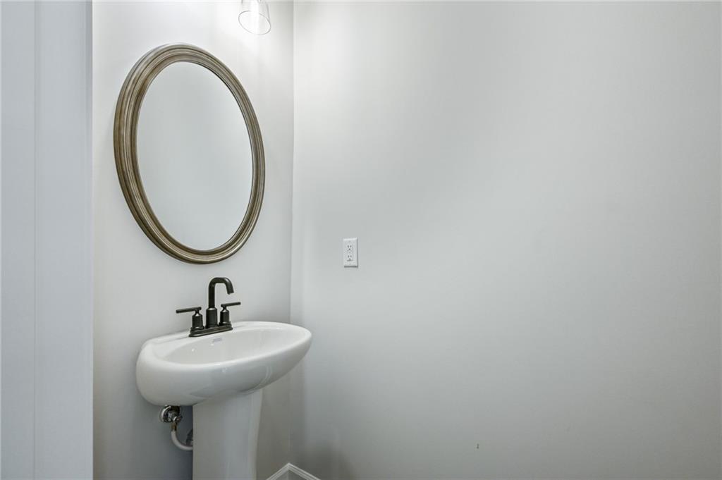 3744 Silvery Way Powder Springs, GA 30127 - Photo 13 of 26 a bathroom with a sink and a mirror