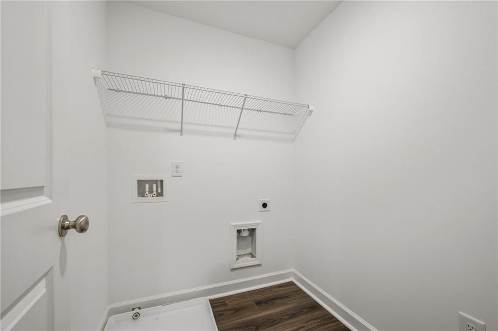 3744 Silvery Way Powder Springs, GA 30127 - Photo 18 of 26 a view of storage and utility room with racks on the wall