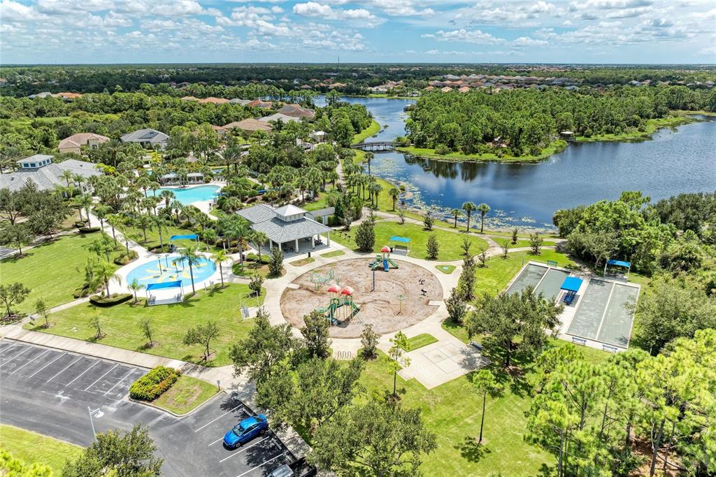 12642 Harney Street Venice, FL 34293 - Photo 70 of 85 an aerial view of a house with a lake view