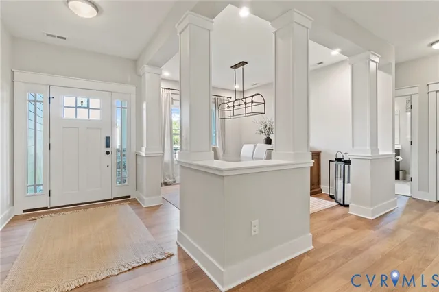 a view of kitchen with stainless steel appliances kitchen island sink and refrigerator