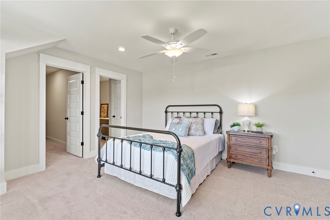 16851 Sheppards Fold Way Beaverdam, VA 23015 - Photo 27 of 33 a bedroom with a bed and a chandelier