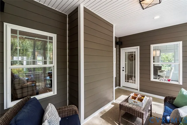 a outdoor living space with furniture and a window