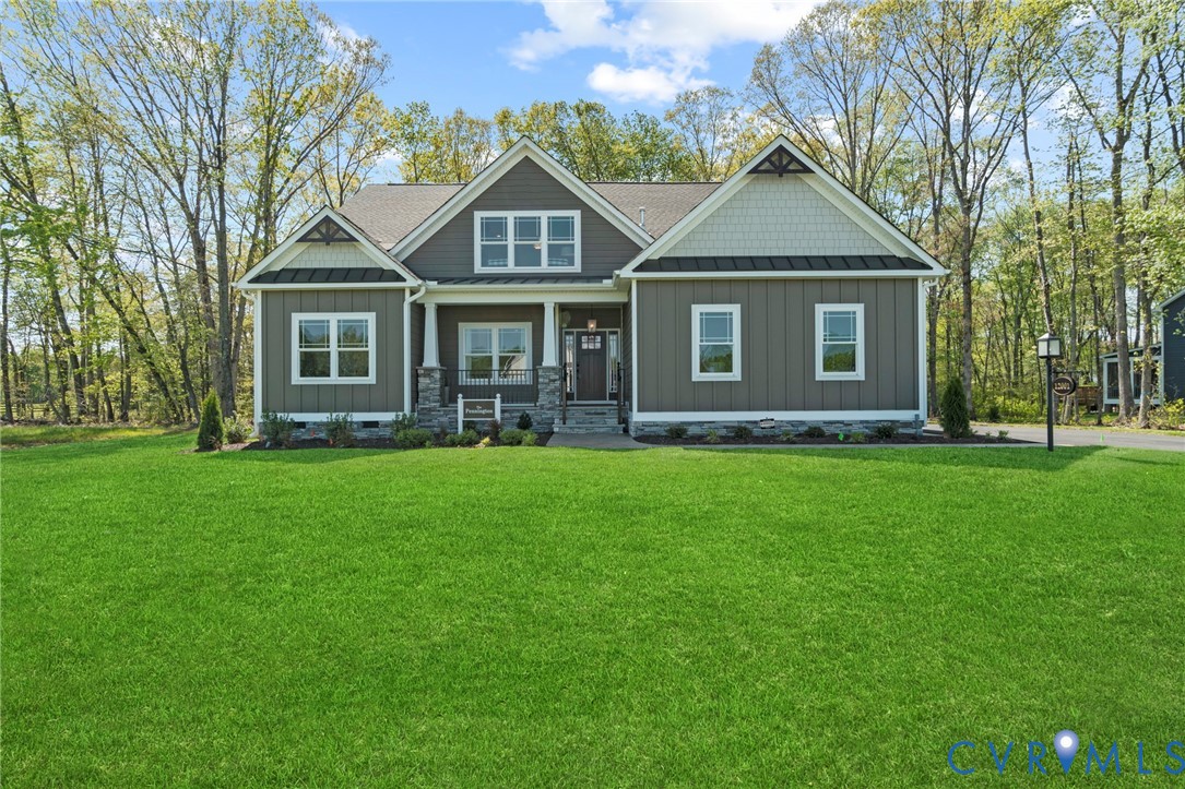 16851 Sheppards Fold Way Beaverdam, VA 23015 - Photo 33 of 33 a front view of a house with a garden and trees