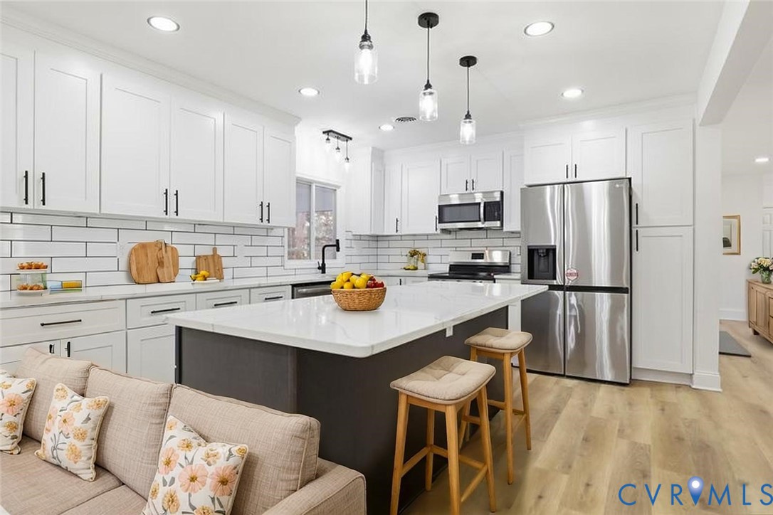 2913 Rolyart Road Petersburg, VA 23805 - Photo 11 of 31 Kitchen with stainless steel appliances, white cab