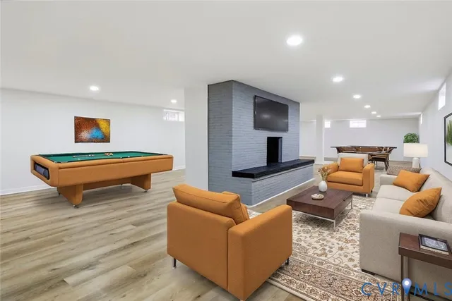 a dining room with furniture and a floor to ceiling window