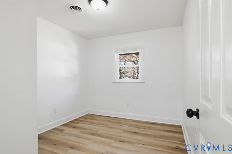 2913 Rolyart Road Petersburg, VA 23805 - Photo 23 of 31 Unfurnished room featuring baseboards and light wo