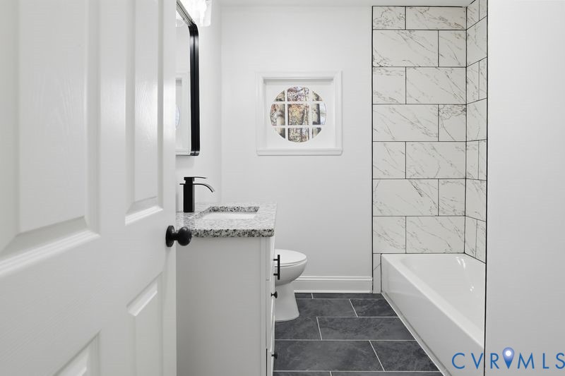 2913 Rolyart Road Petersburg, VA 23805 - Photo 24 of 31 Bathroom with vanity, shower / washtub combination