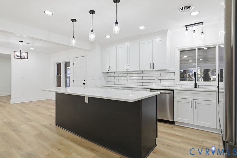 2913 Rolyart Road Petersburg, VA 23805 - Photo 7 of 31 Kitchen with white cabinets, stainless steel appli
