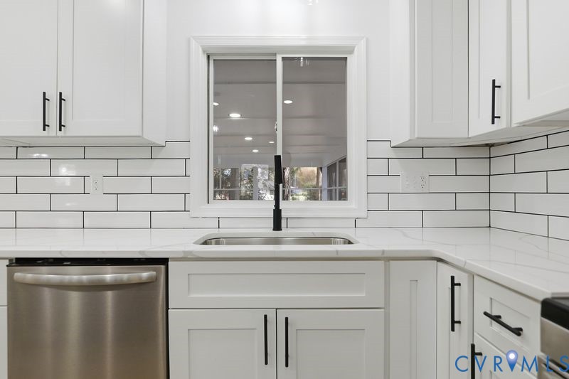 2913 Rolyart Road Petersburg, VA 23805 - Photo 10 of 31 Kitchen with white cabinetry, stainless steel dish