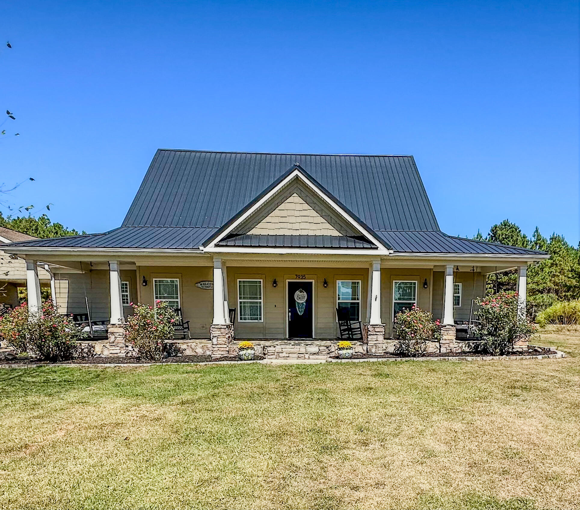 a front view of a house with garden