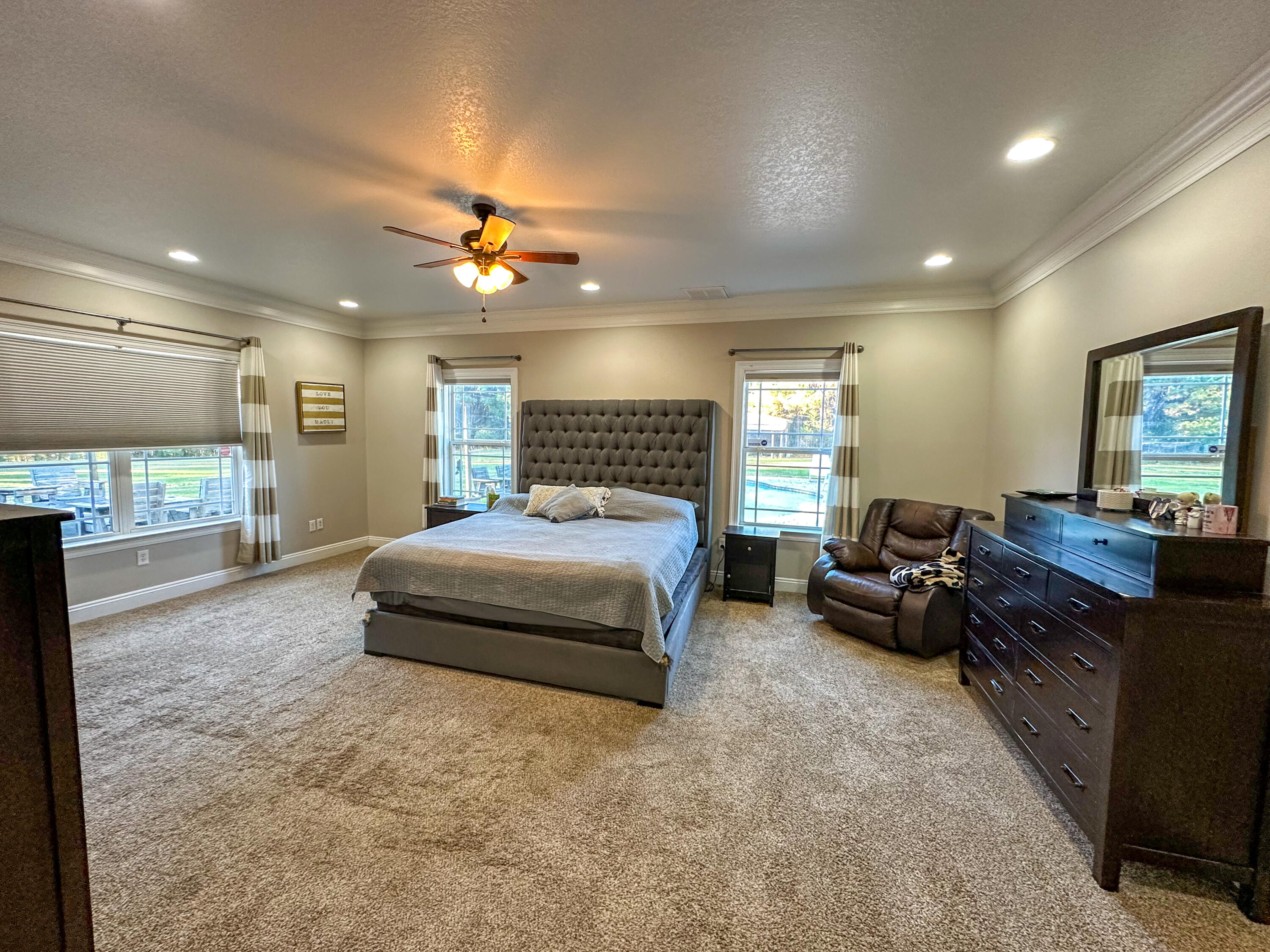7935 Peacock Road Baker, FL 32531 - Photo 11 of 20 a spacious bedroom with a bed and dresser