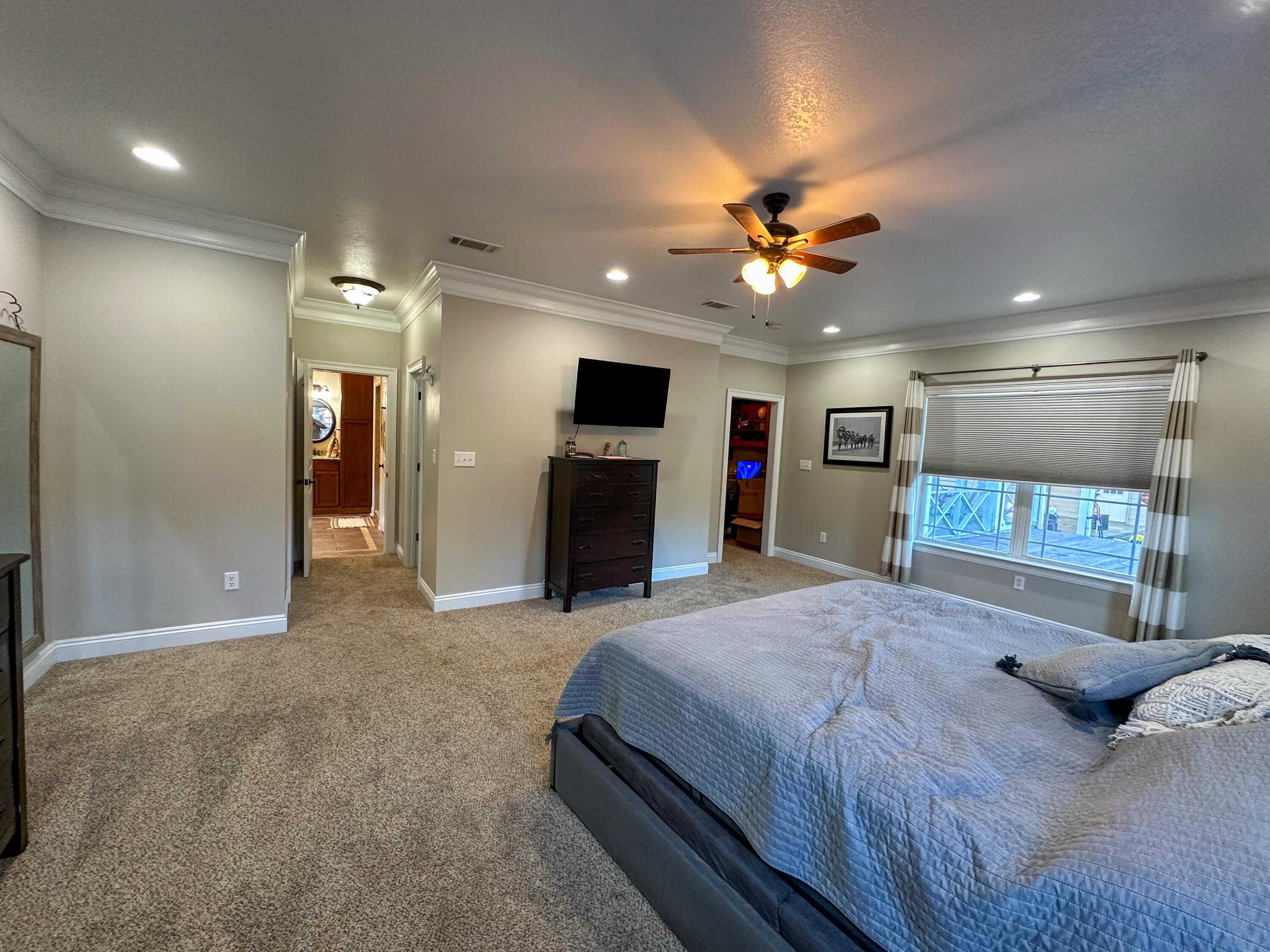 7935 Peacock Road Baker, FL 32531 - Photo 10 of 20 a bedroom with a bed and a mirror