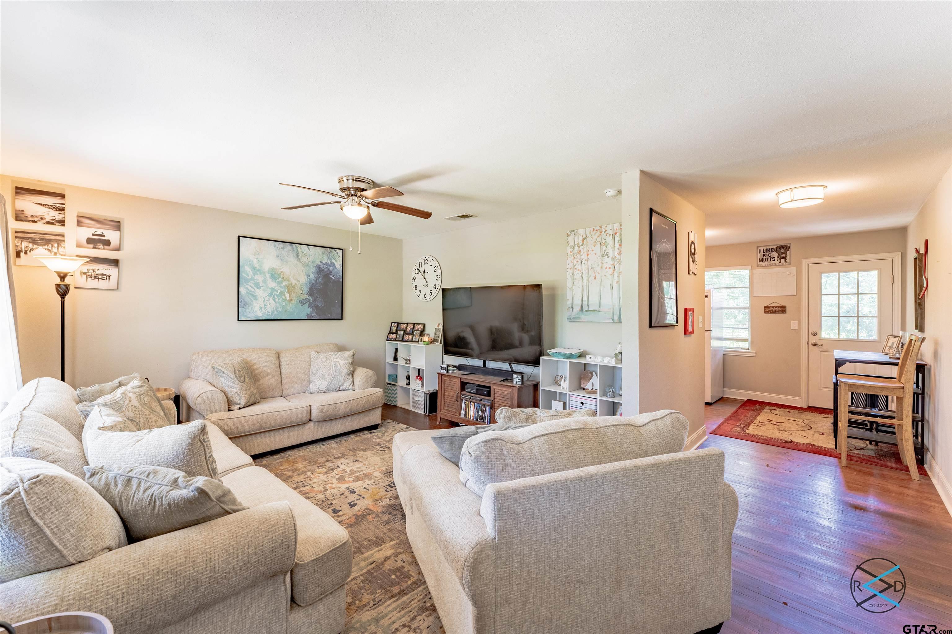 1506 Bassett Road Palestine, TX 75803 - Photo 4 of 18 a living room with furniture wooden floor and a flat screen tv