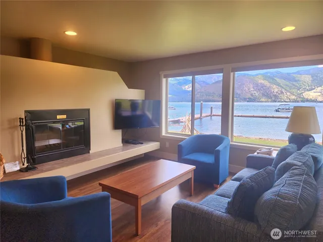 a kitchen with a table chairs sink and cabinets