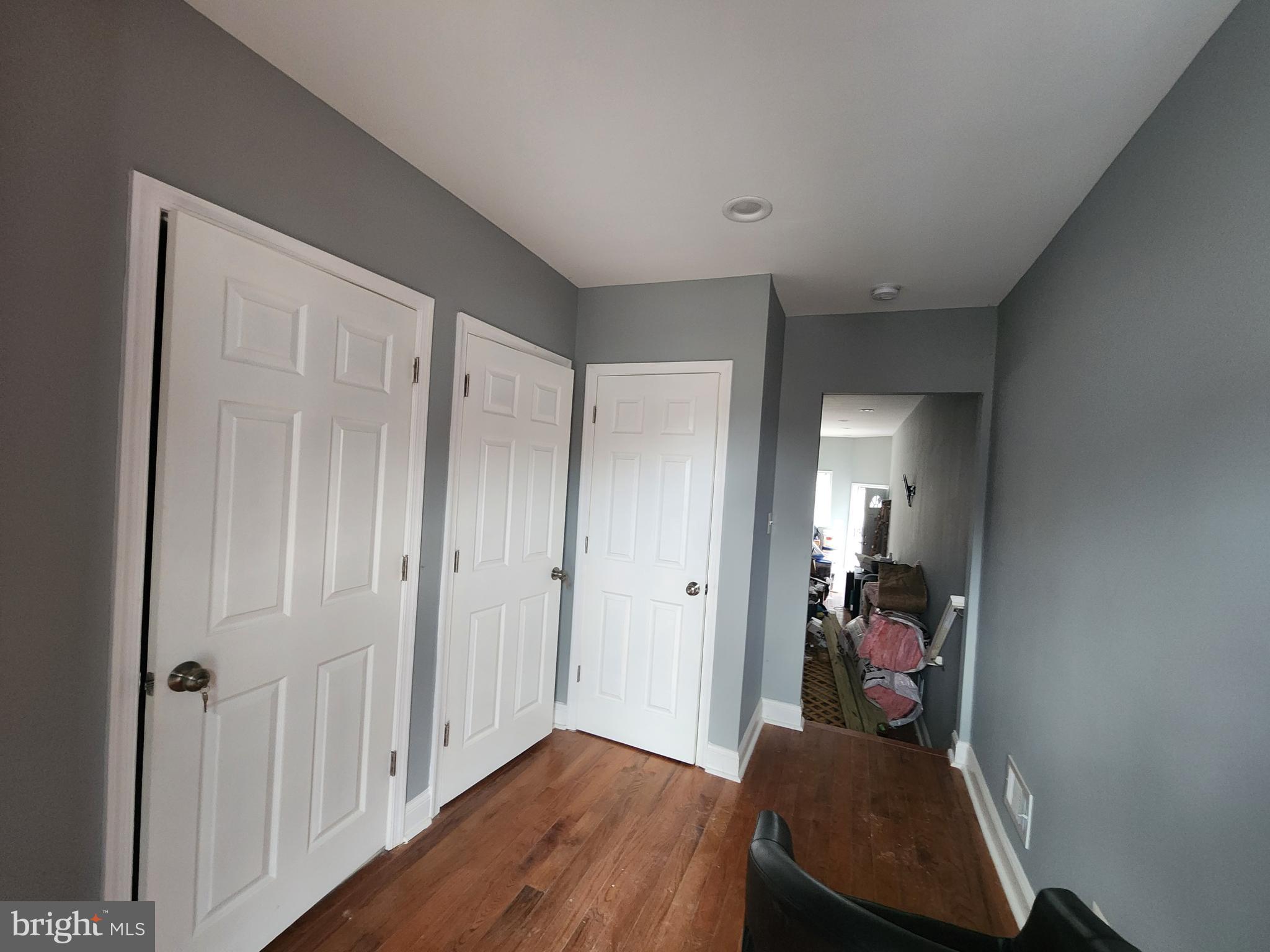 1629 Rutland Avenue Baltimore, MD 21213 - Photo 11 of 20 a view of a hallway and wooden floor and closet