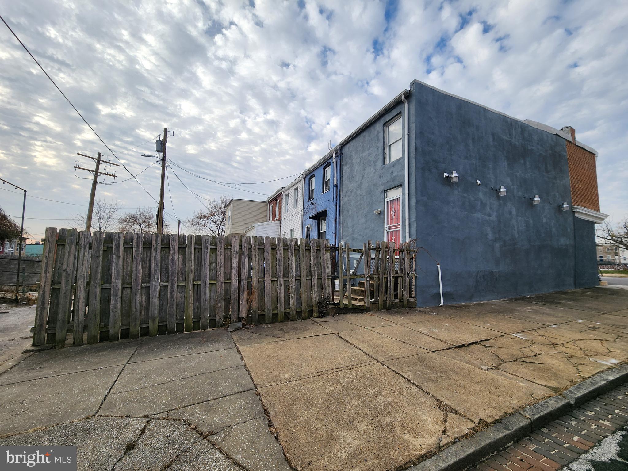 1629 Rutland Avenue Baltimore, MD 21213 - Photo 18 of 20 a view of a house with a wooden fence