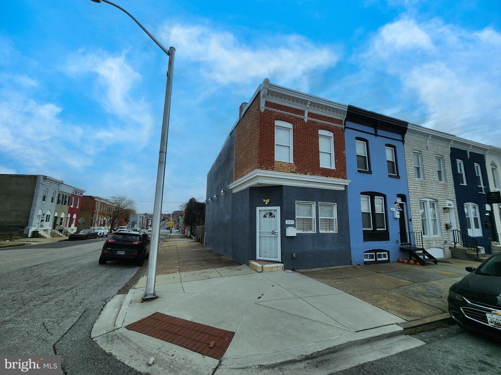 1629 Rutland Avenue Baltimore, MD 21213 - Photo 2 of 20 a car parked in front of a building