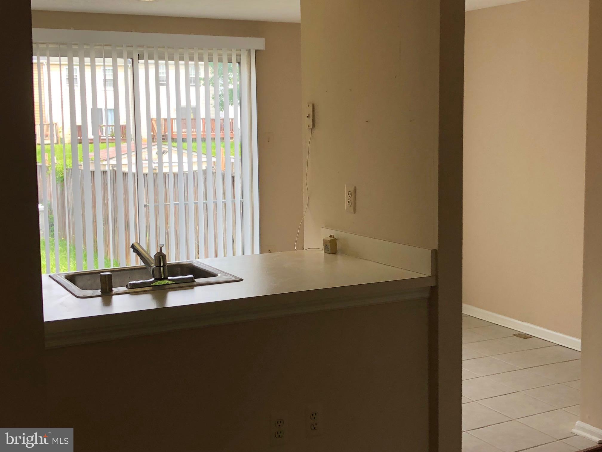 2212 Riding Crop Way Baltimore, MD 21244 - Photo 5 of 19 a room with a table and windows