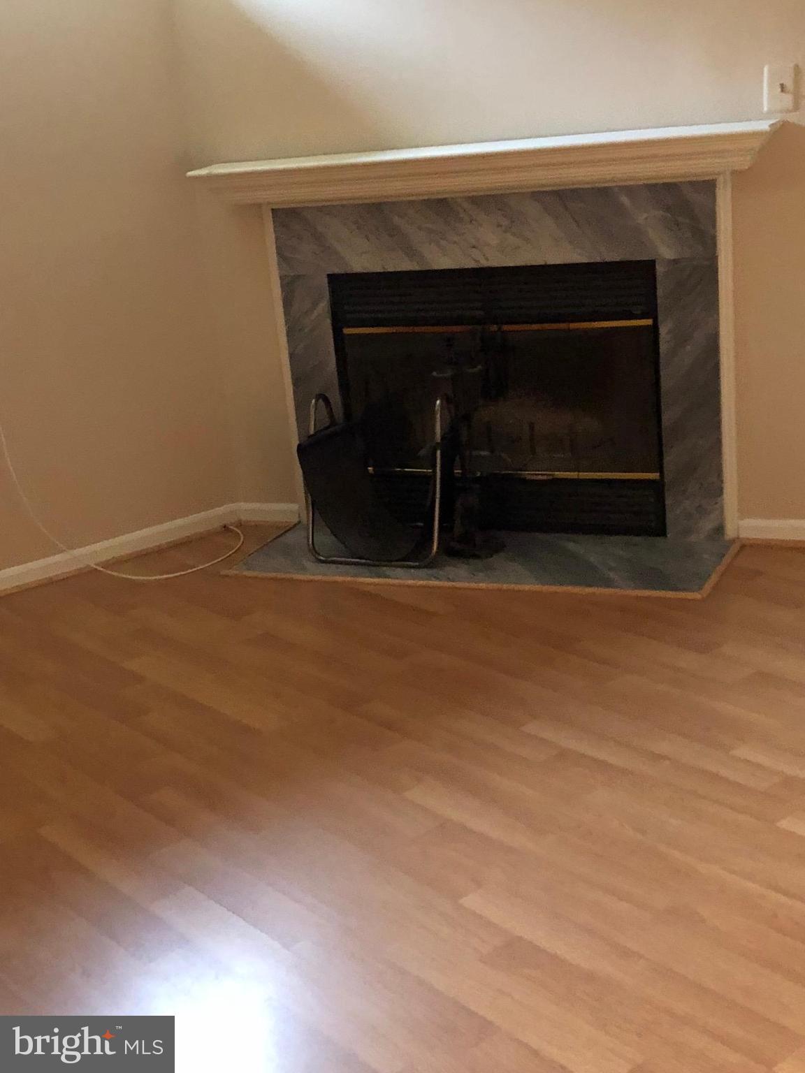 2212 Riding Crop Way Baltimore, MD 21244 - Photo 6 of 19 a living room with a fireplace