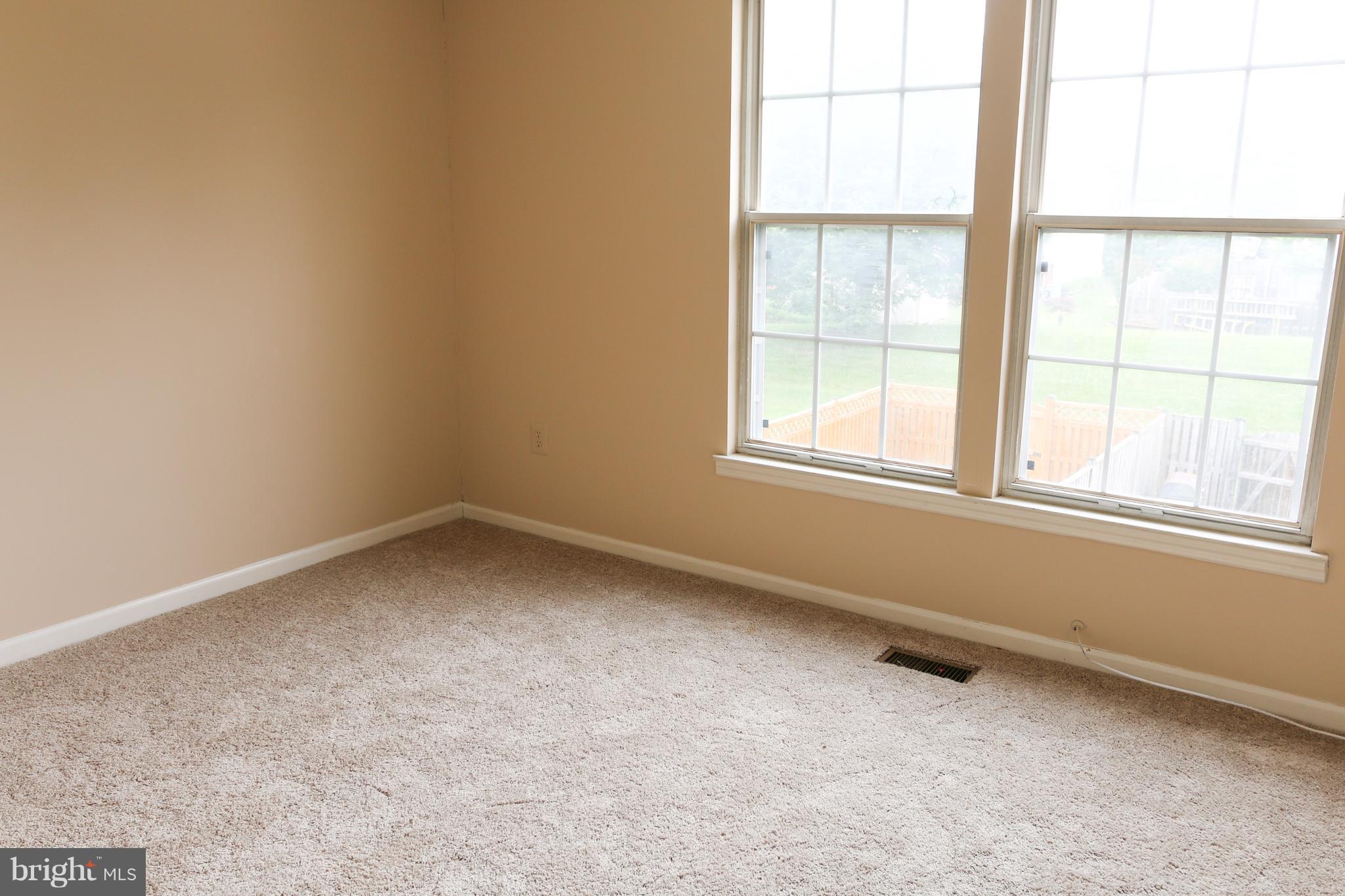 2212 Riding Crop Way Baltimore, MD 21244 - Photo 10 of 19 an empty room with a window