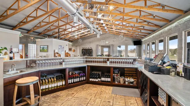 a view of a chairs and a table in the balcony